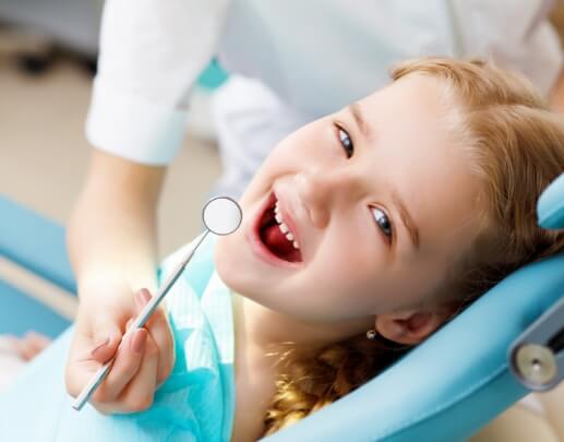 Young child receiving dental exam