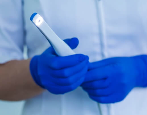 Dentist holding an intraoral camera