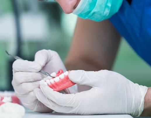 Lab technician crafting a denture
