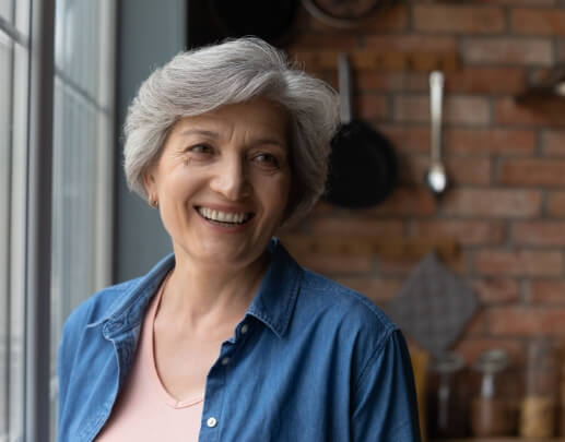 Older woman with dentures smiling