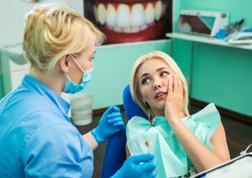 Woman talking to dentist during dental appointment
