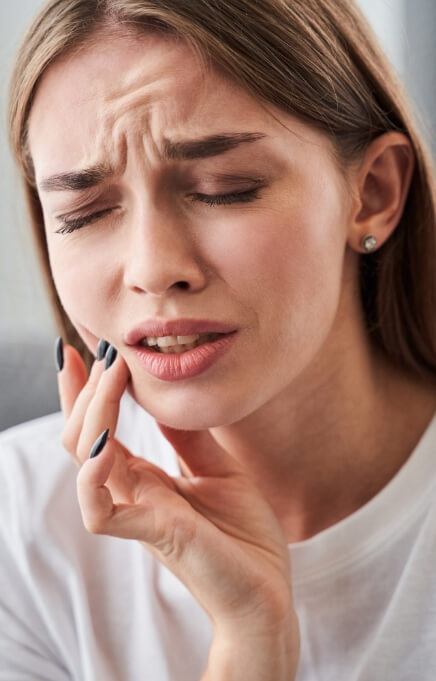 Woman in pain before emergency dentistry