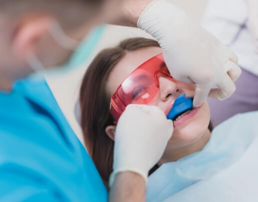 Dental patient receiving fluoride treatment