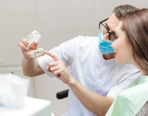 Dentist and patient discussing the cost of dental implants