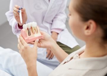 Dentist and patient talking during the initial dental implant consultation