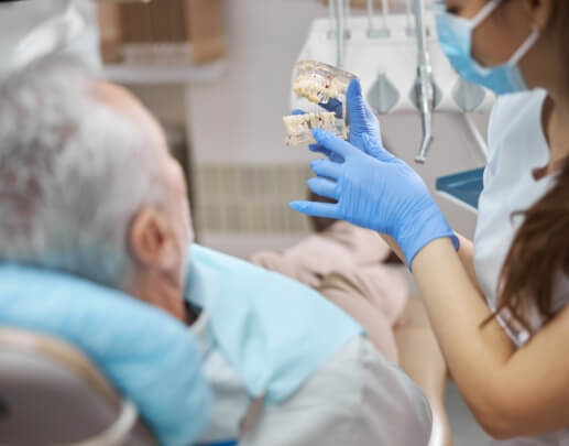 Doctor Jimenez talking to dental patient