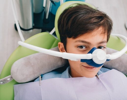 Young dental patient receiving nitrous oxide dental sedation