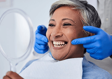 a patient smiling before undergoing cosmetic dentistry